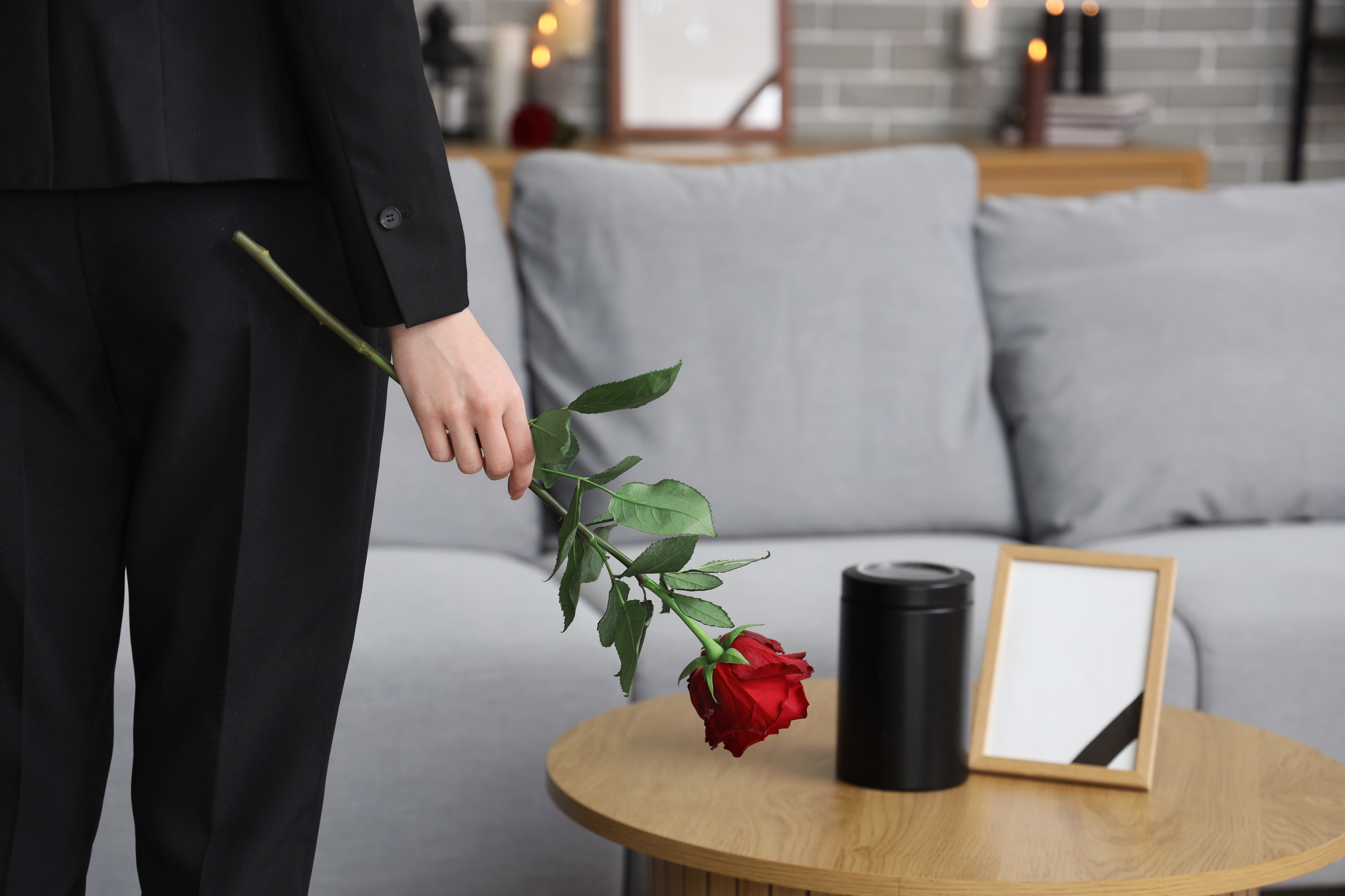 Mourning Young Woman with Rose at Home, Closeup